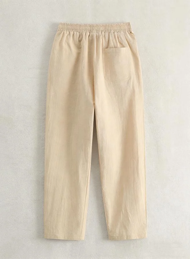 تايك تو بنطال سادة بنسيج بارز ورباط خصر